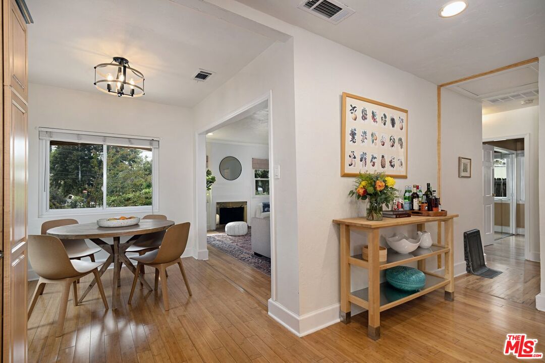 4905 Wiota Street Los Angeles, CA 90041 - Photo 16 of 38 a view of a dining room with furniture window and wooden floor