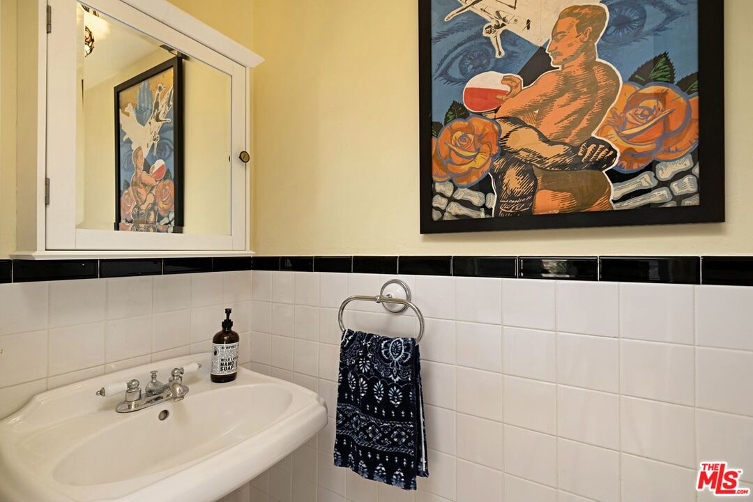 4905 Wiota Street Los Angeles, CA 90041 - Photo 25 of 38 a bathroom with a sink and a mirror