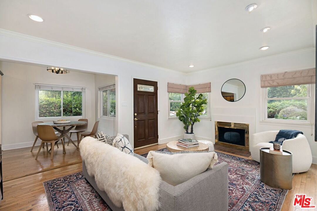 4905 Wiota Street Los Angeles, CA 90041 - Photo 9 of 38 a living room with furniture a fireplace and a window