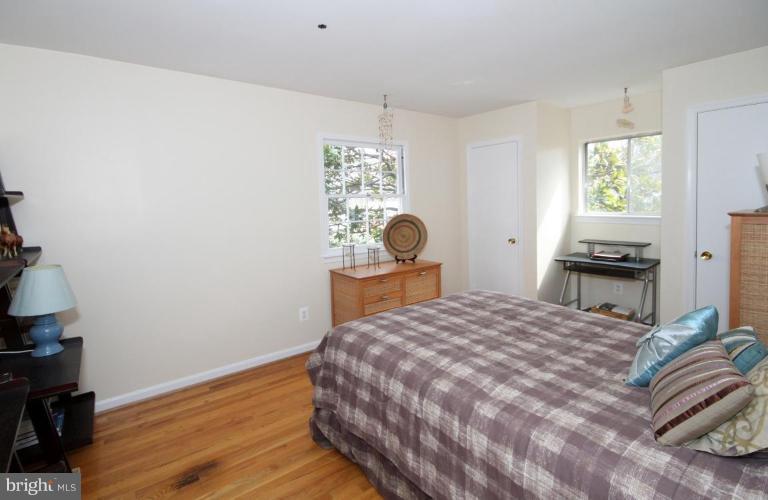 6108 Roxbury Avenue Springfield, VA 22152 - Photo 17 of 30 a bedroom with a bed and a window