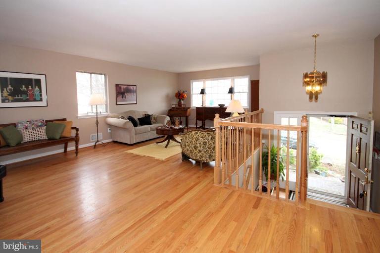 6108 Roxbury Avenue Springfield, VA 22152 - Photo 3 of 30 a living room with furniture and a wooden floor