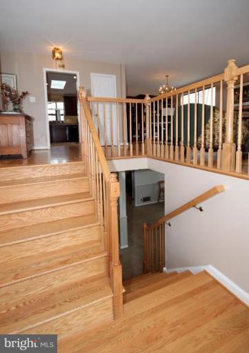 6108 Roxbury Avenue Springfield, VA 22152 - Photo 26 of 30 a view of entryway and hall with wooden floor