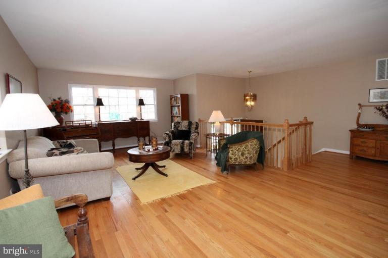 6108 Roxbury Avenue Springfield, VA 22152 - Photo 4 of 30 a living room with furniture and a wooden floor