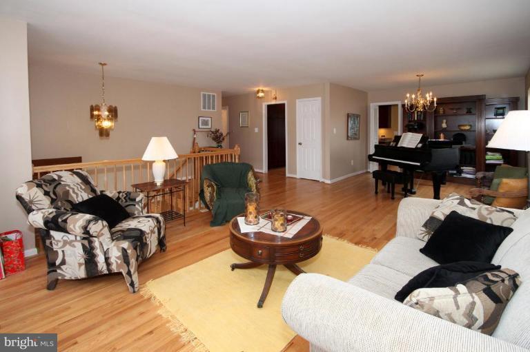 6108 Roxbury Avenue Springfield, VA 22152 - Photo 6 of 30 a living room with furniture and a wooden floor