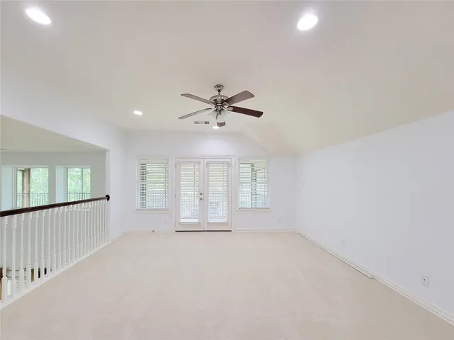 a view of a hallway with windows