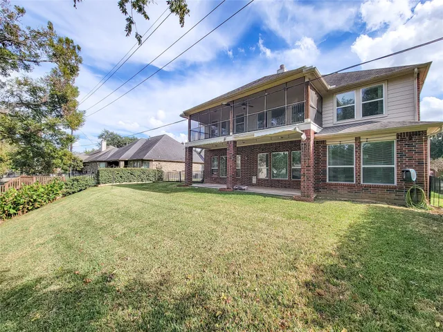 a view of a park with large trees
