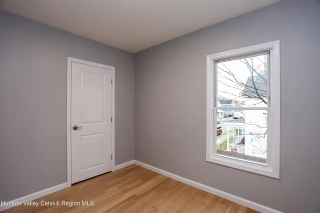 a view of an empty room and window