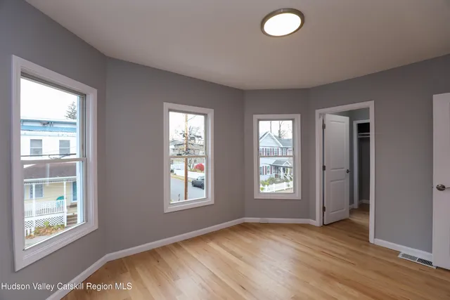 a view of livingroom with window and hardwood floor