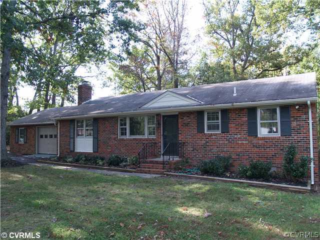 3319 Quaker Road Quinton, VA 23141 - Photo 1 of 11 a front view of a house with a garden