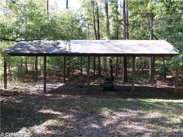 3319 Quaker Road Quinton, VA 23141 - Photo 11 of 11 a view of a house with backyard and a sitting area
