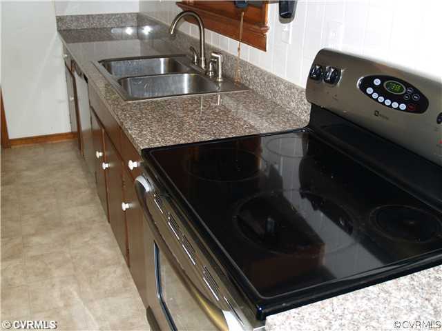 3319 Quaker Road Quinton, VA 23141 - Photo 4 of 11 a kitchen with a sink and cabinets