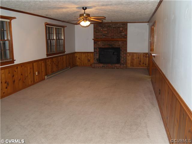3319 Quaker Road Quinton, VA 23141 - Photo 6 of 11 wooden floor in an empty room with a fireplace