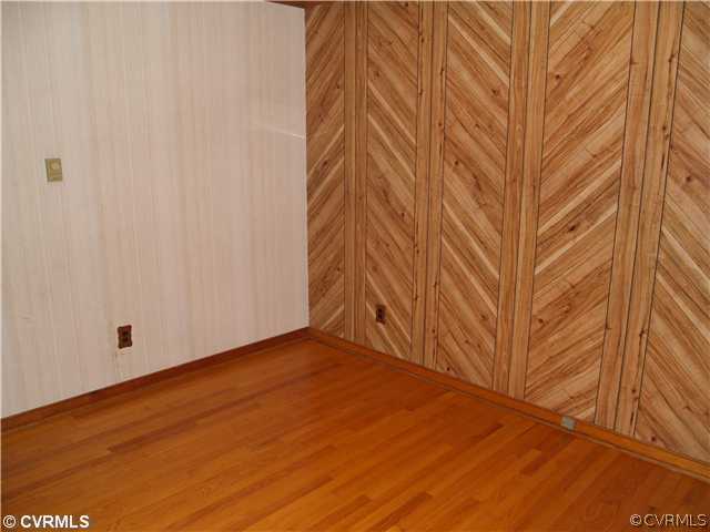 3319 Quaker Road Quinton, VA 23141 - Photo 9 of 11 a view of empty room with wooden floor and fan