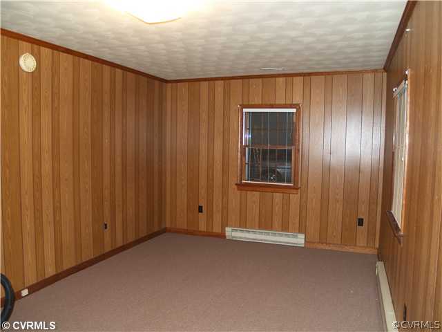 3319 Quaker Road Quinton, VA 23141 - Photo 10 of 11 a view of an empty room with wooden door