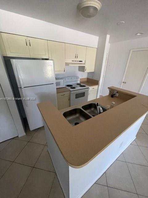 4751 Via Palm Lakes, Unit 419 West Palm Beach, FL 33417 - Photo 11 of 11 a kitchen with stainless steel appliances granite countertop a sink and a stove