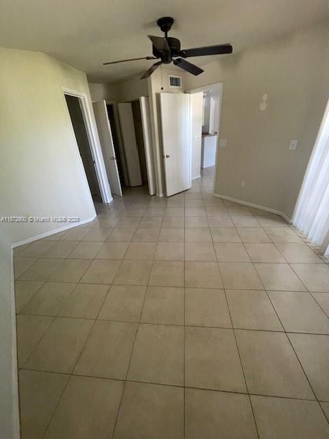 4751 Via Palm Lakes, Unit 419 West Palm Beach, FL 33417 - Photo 7 of 11 a view of a livingroom with a chandelier fan and windows