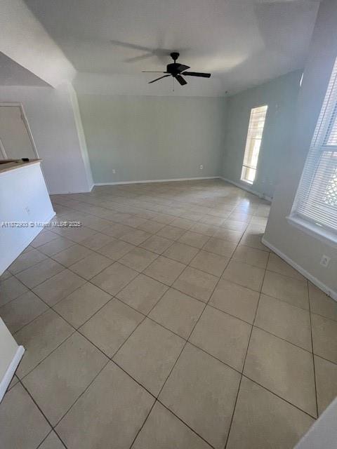 4751 Via Palm Lakes, Unit 419 West Palm Beach, FL 33417 - Photo 8 of 11 an empty room with windows and fan