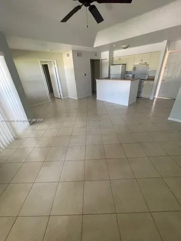 a kitchen with stainless steel appliances granite countertop a sink and a stove