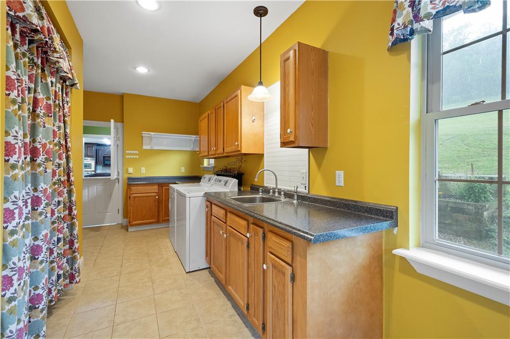 102 Klages Road West Alexander, PA 15376 - Photo 17 of 50 a kitchen with stainless steel appliances granite countertop a sink and a refrigerator
