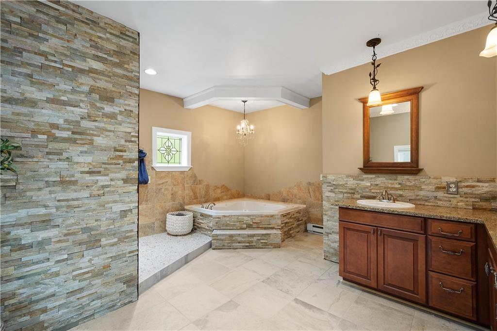 102 Klages Road West Alexander, PA 15376 - Photo 24 of 50 a spacious bathroom with a granite countertop sink a toilet and mirror