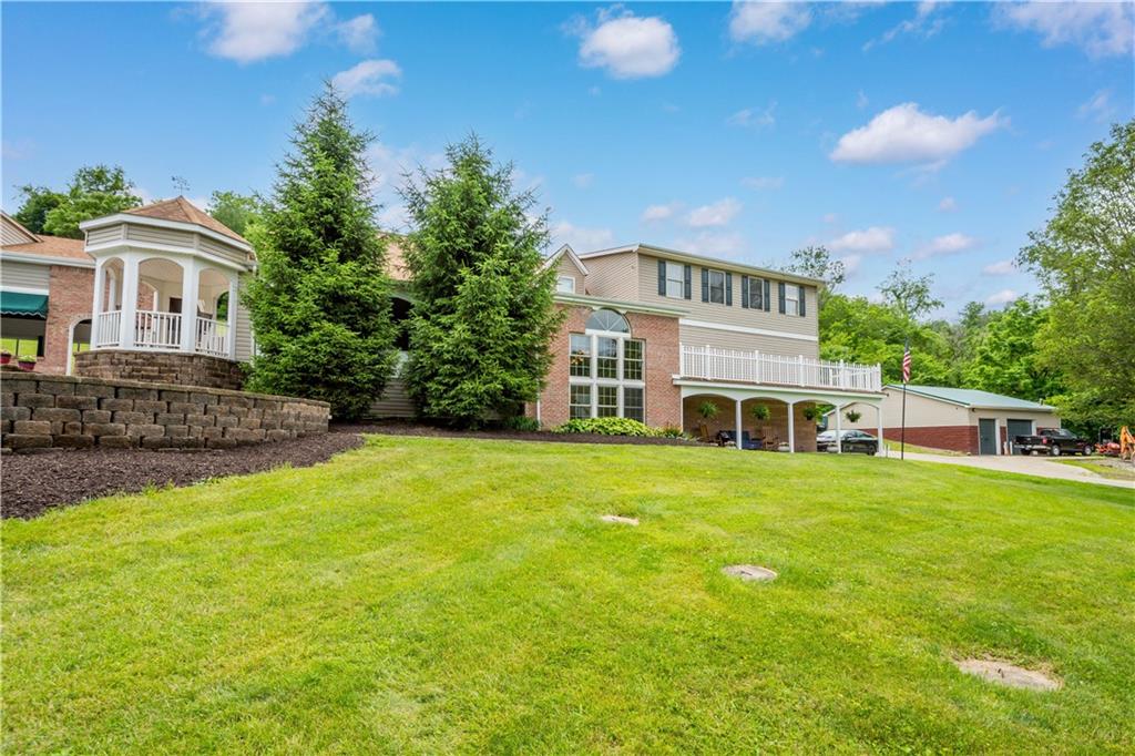 102 Klages Road West Alexander, PA 15376 - Photo 3 of 50 a front view of a house with a garden