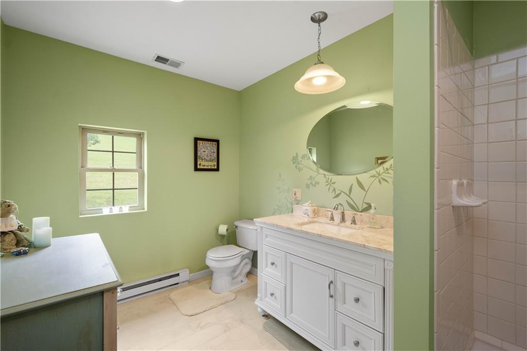 102 Klages Road West Alexander, PA 15376 - Photo 37 of 50 a bathroom with a granite countertop toilet sink and mirror