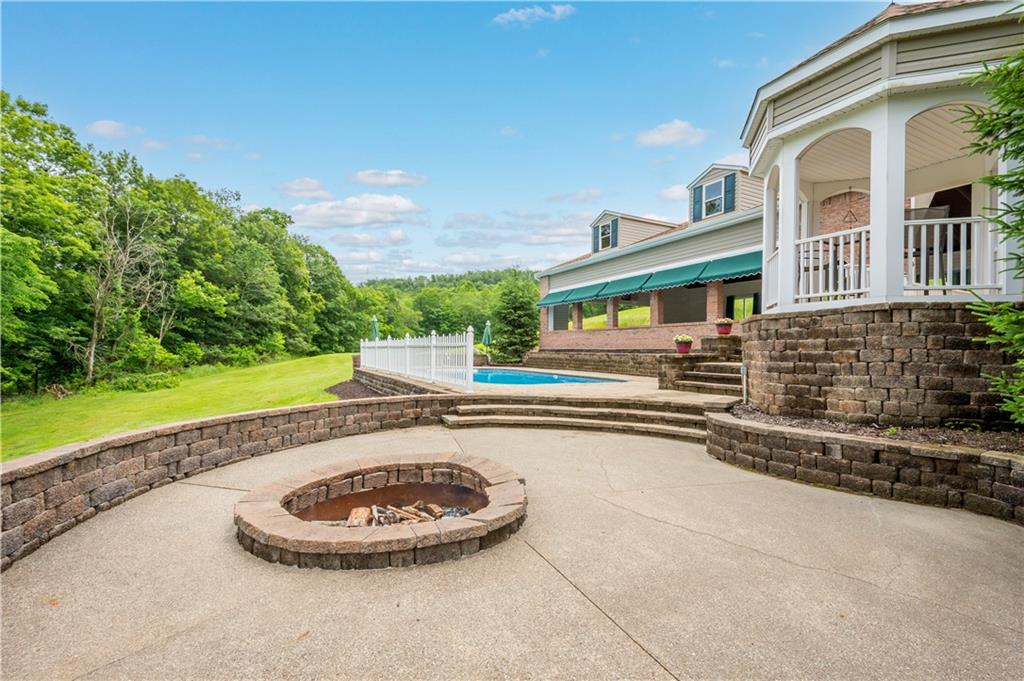 102 Klages Road West Alexander, PA 15376 - Photo 44 of 50 a view of a house with a swimming pool and sitting area