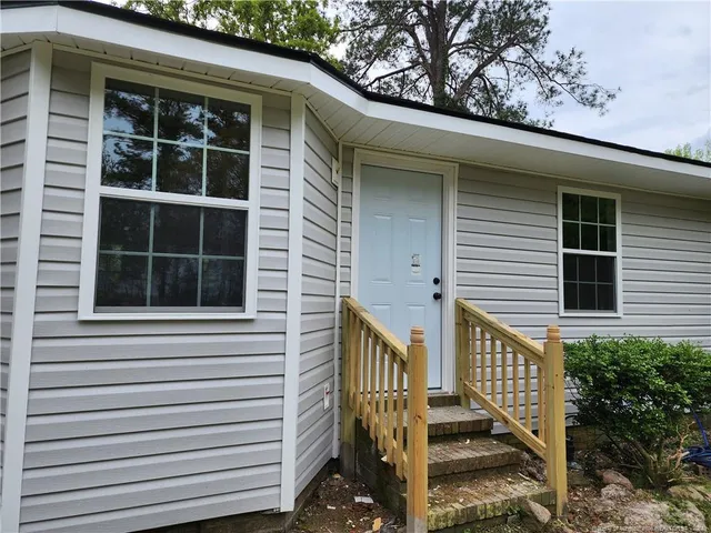 a view of a house with a window and stairs