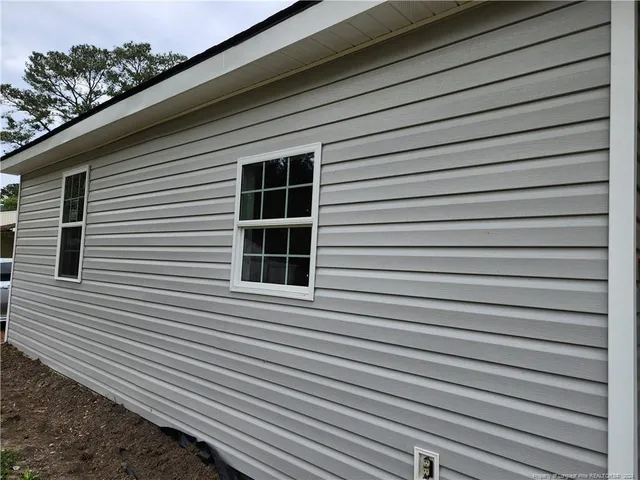 a view of a house with a large window