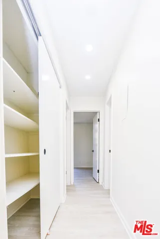 a bathroom with a granite countertop sink mirror and vanity
