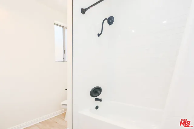 a bathroom with a double vanity sink and mirror