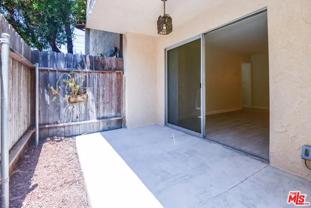 a kitchen with a refrigerator and a stove