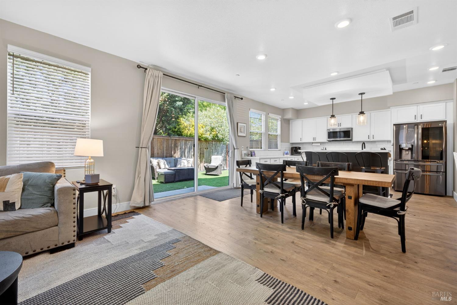 2215-2217 Versaro Drive Santa Rosa, CA 95403 - Photo 15 of 45 a view of a dining room with furniture window and outside view