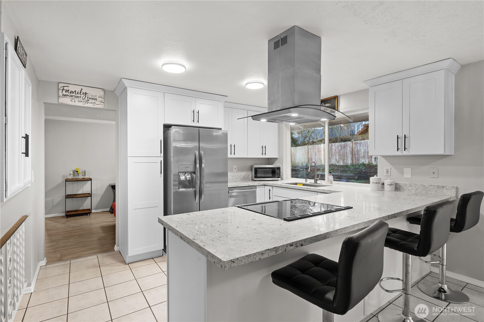 3907 Southwest 328th Street Federal Way, WA 98023 - Photo 14 of 40 a kitchen with stainless steel appliances granite countertop a sink a stove a refrigerator and island