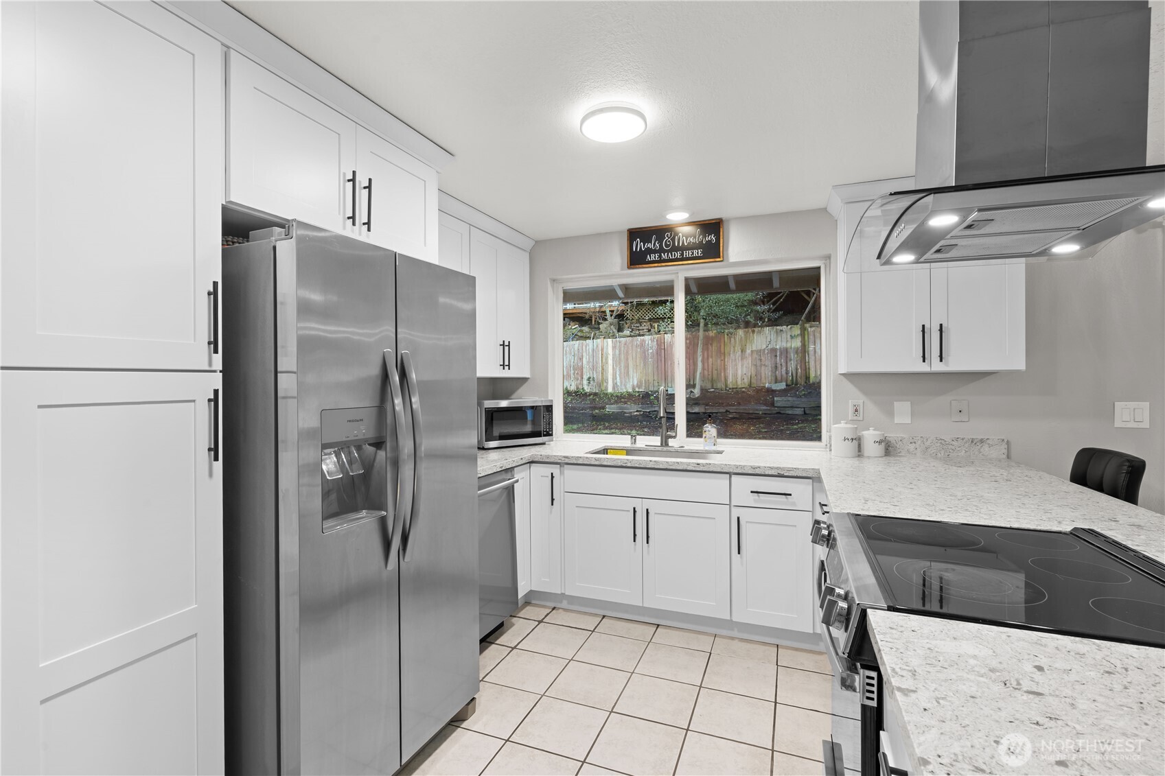 3907 Southwest 328th Street Federal Way, WA 98023 - Photo 15 of 40 a kitchen with a refrigerator a sink and cabinets