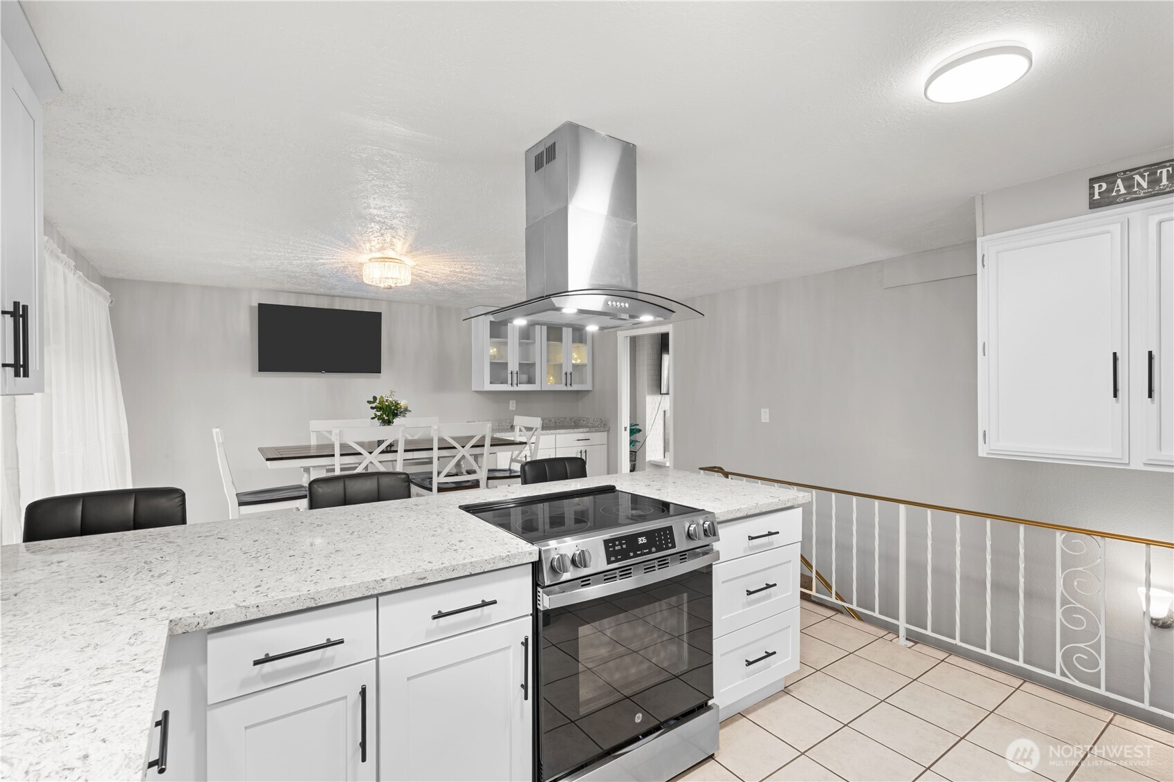 3907 Southwest 328th Street Federal Way, WA 98023 - Photo 16 of 40 a kitchen with a stove and a white cabinets