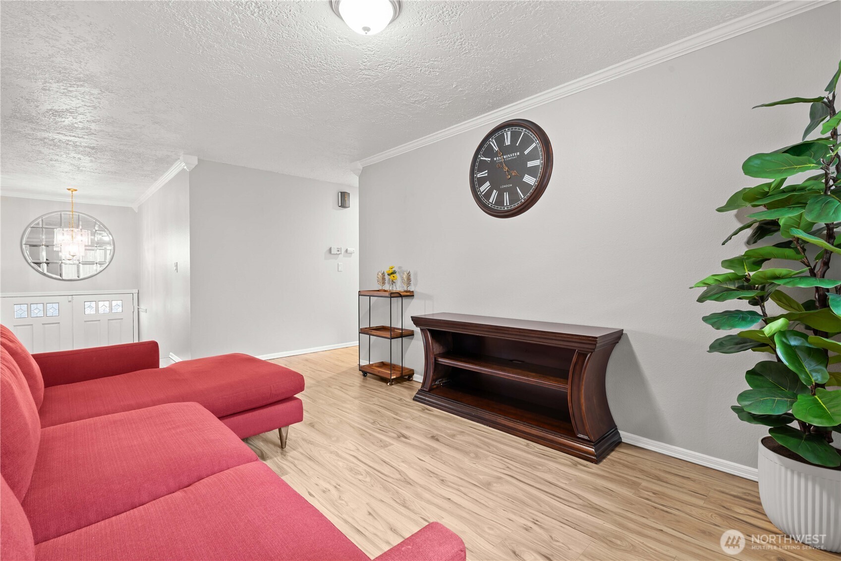 3907 Southwest 328th Street Federal Way, WA 98023 - Photo 18 of 40 a living room with furniture a clock and a potted plant