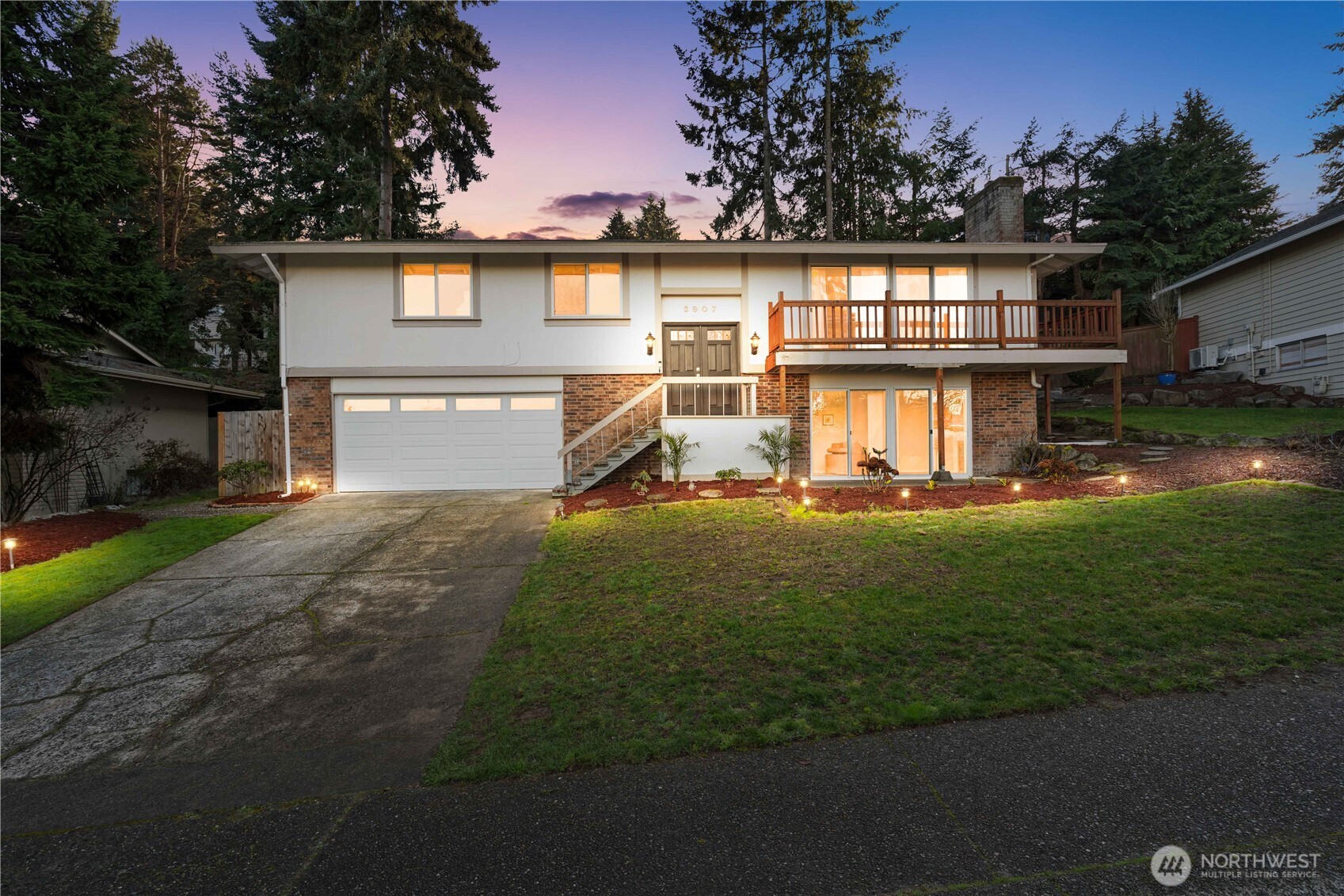3907 Southwest 328th Street Federal Way, WA 98023 - Photo 2 of 40 a front view of a house with a yard and lake view