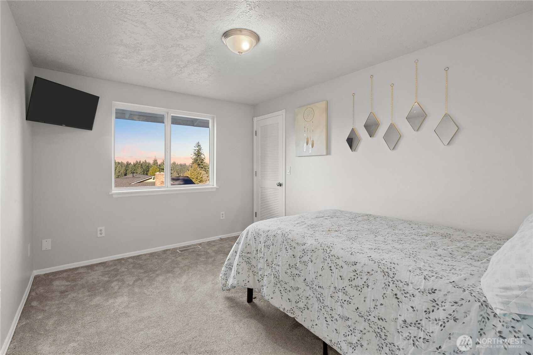 3907 Southwest 328th Street Federal Way, WA 98023 - Photo 23 of 40 a bedroom with a bed and a window