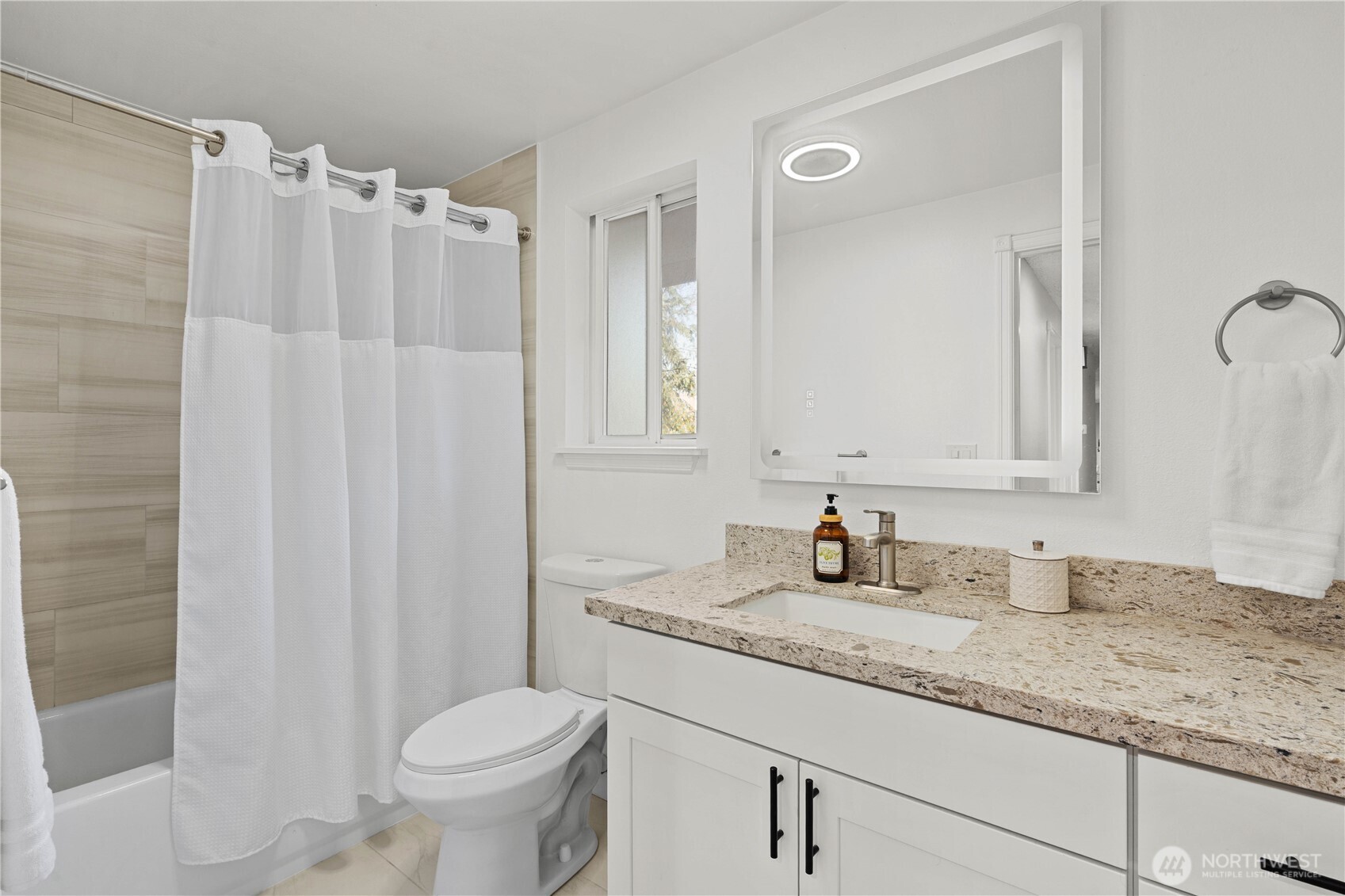 3907 Southwest 328th Street Federal Way, WA 98023 - Photo 24 of 40 a bathroom with a granite countertop sink toilet and mirror