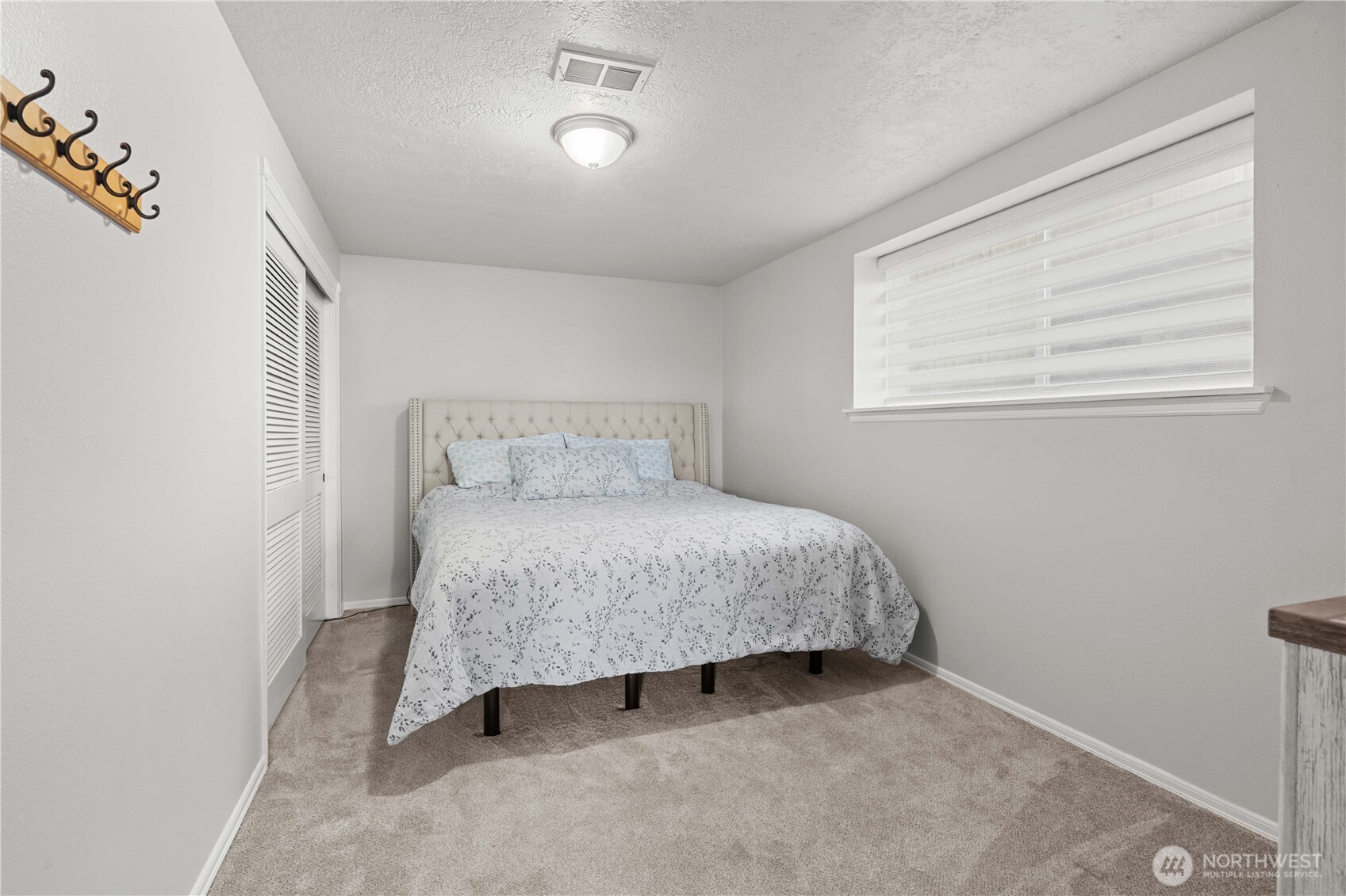 3907 Southwest 328th Street Federal Way, WA 98023 - Photo 28 of 40 a bedroom with a bed and window