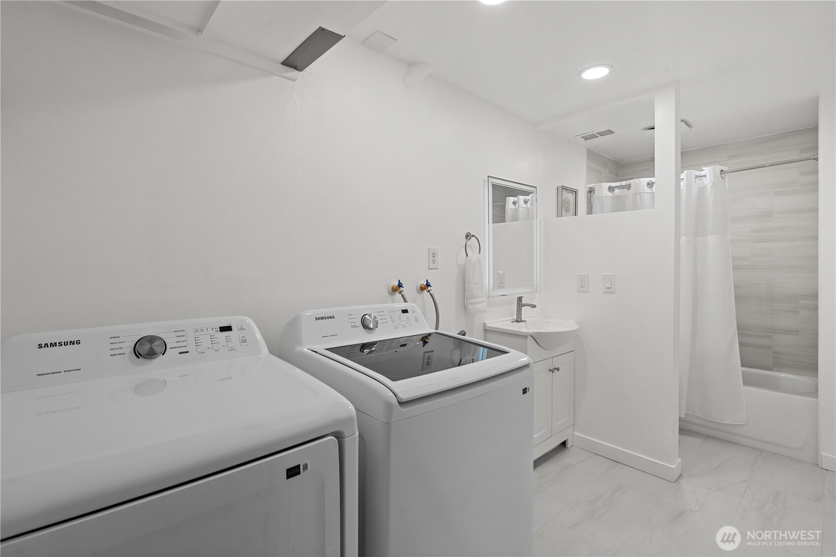 3907 Southwest 328th Street Federal Way, WA 98023 - Photo 30 of 40 a bathroom with a sink a toilet and shower