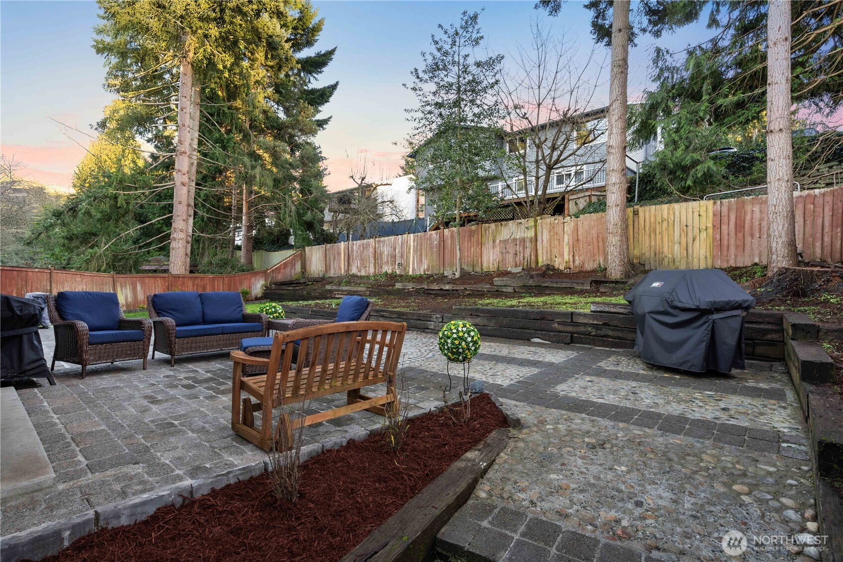 3907 Southwest 328th Street Federal Way, WA 98023 - Photo 31 of 40 a view of backyard with outdoor seating and trees in the background