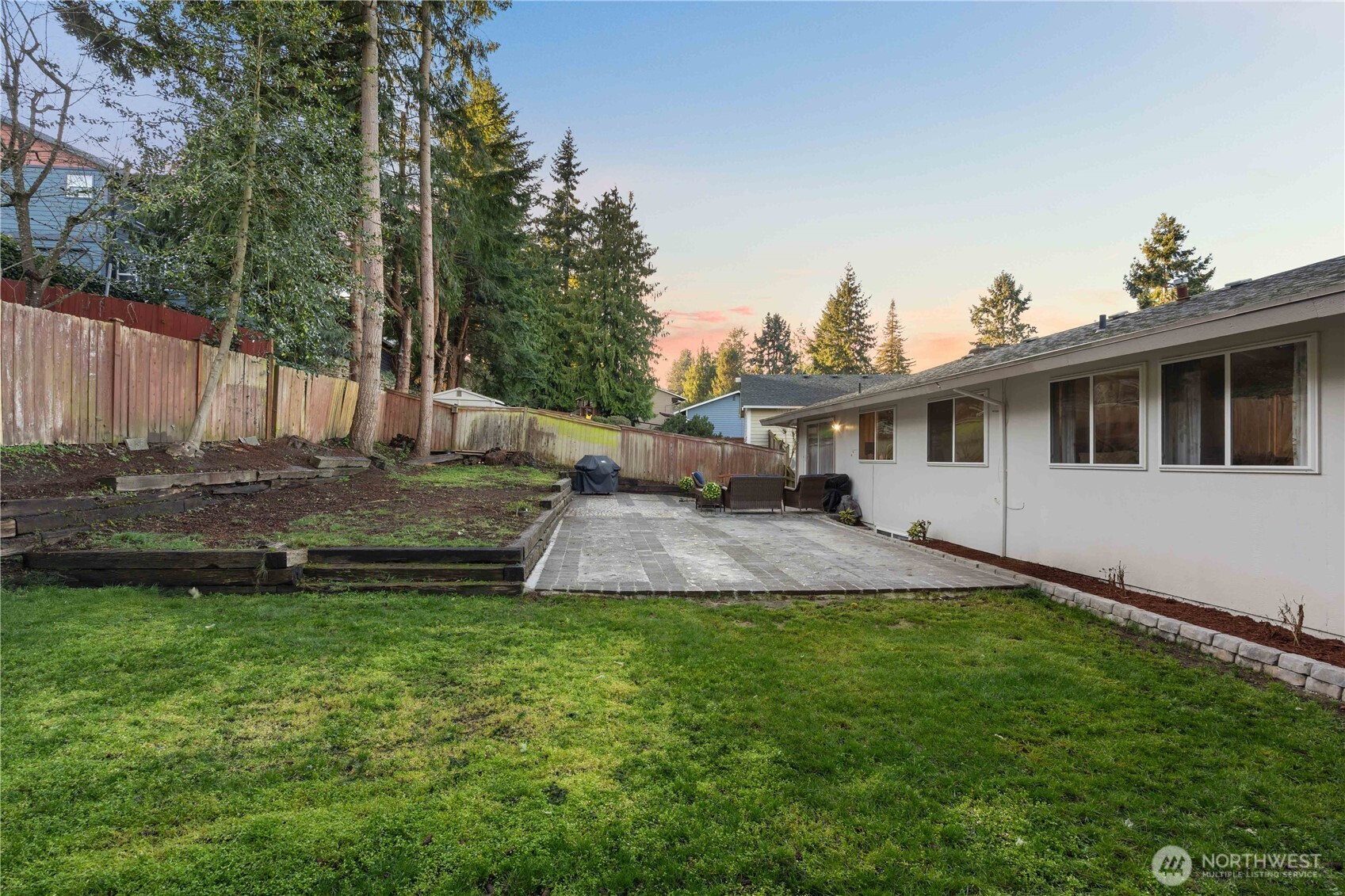 3907 Southwest 328th Street Federal Way, WA 98023 - Photo 34 of 40 a view of a white house with a yard and sitting area