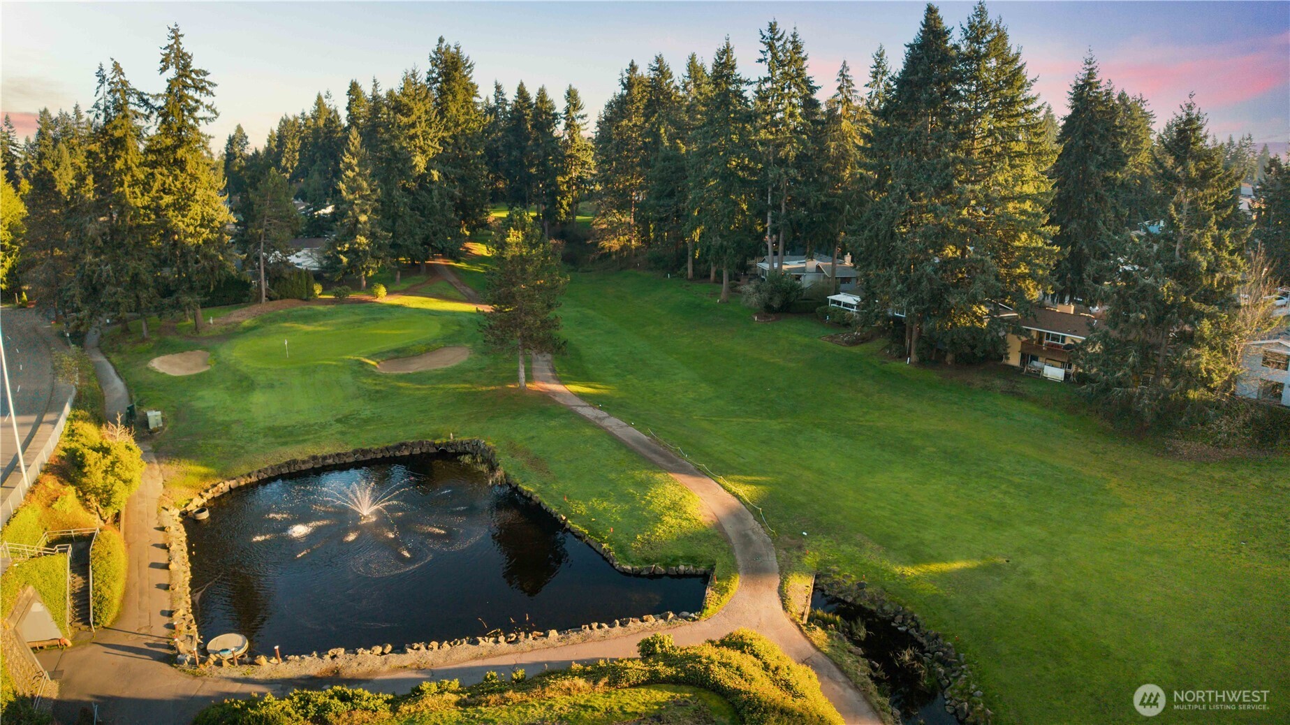 3907 Southwest 328th Street Federal Way, WA 98023 - Photo 38 of 40 a view of a golf course with a swimming pool