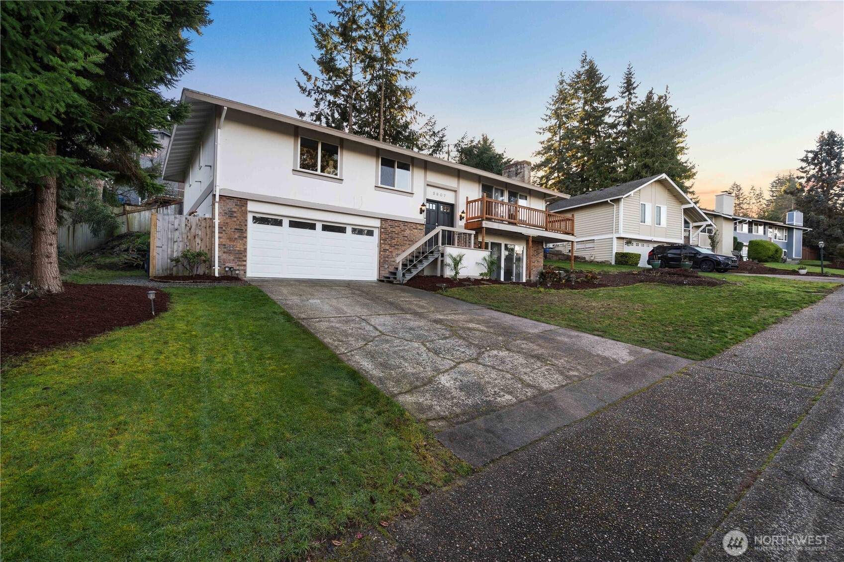 3907 Southwest 328th Street Federal Way, WA 98023 - Photo 40 of 40 a view of a house with a yard and large tree