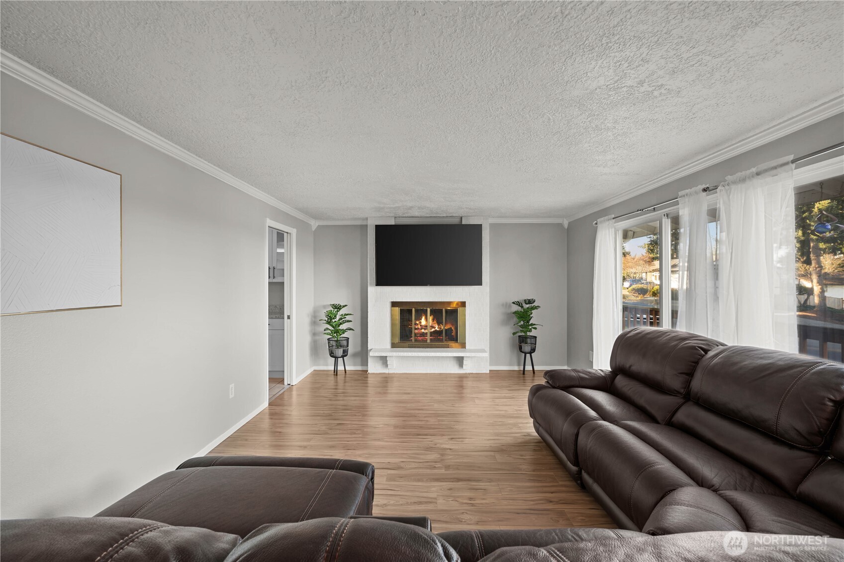 3907 Southwest 328th Street Federal Way, WA 98023 - Photo 6 of 40 a living room with furniture and a fireplace