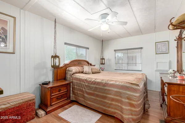 a bed room with a bed and a chandelier