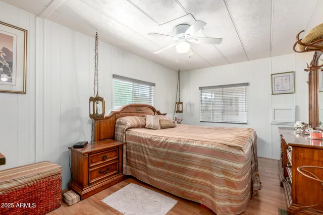 a bed room with a bed and a chandelier