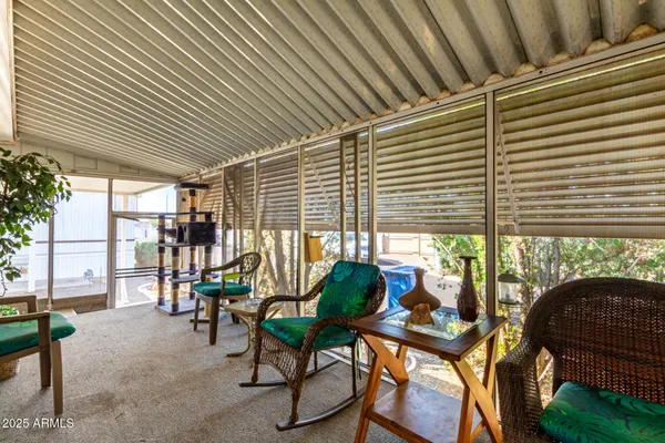 a balcony view with a seating space